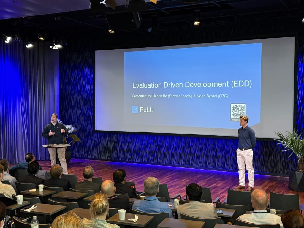 Noah Syrdal and Henrik Bø presenting Evaluation-Driven Development at Telenor AI & Breakfast